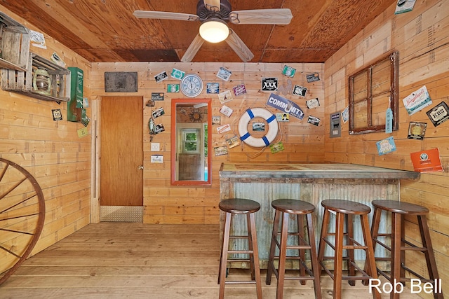3897 Obrien St SW, Grand Rapids, MI 49534 - indoor dry bar featuring wood walls, wood ceiling, hardwood / wood-style floors, and a ceiling fan