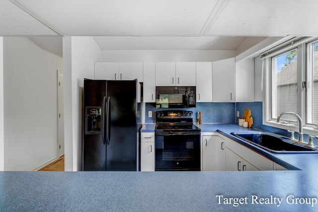 271 Rolling Greene Dr NW, Grand Rapids, MI 49534 - kitchen with black appliances, backsplash, and white cabinets