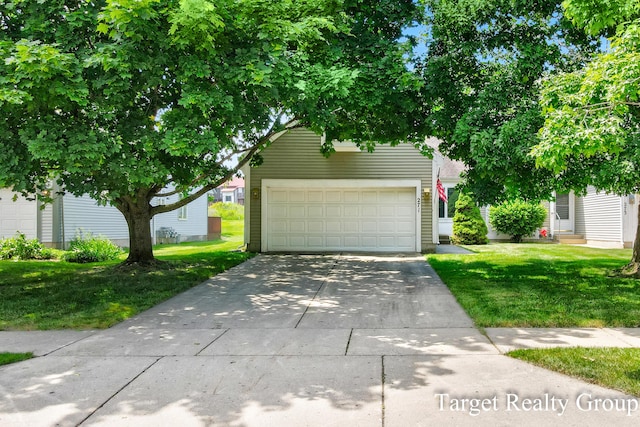 271 Rolling Greene Dr NW, Grand Rapids, MI 49534 - view of front of house featuring entry steps, a front yard, and concrete driveway