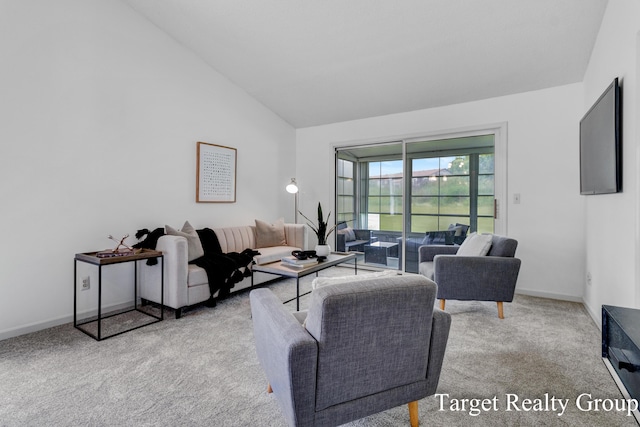 271 Rolling Greene Dr NW, Grand Rapids, MI 49534 - carpeted living room featuring lofted ceiling and baseboards