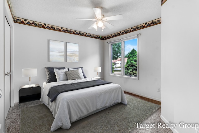 271 Rolling Greene Dr NW, Grand Rapids, MI 49534 - bedroom with carpet flooring, a textured ceiling, and ceiling fan