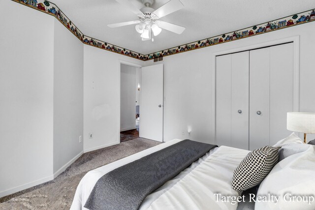 271 Rolling Greene Dr NW, Grand Rapids, MI 49534 - bedroom with carpet flooring, a closet, and ceiling fan