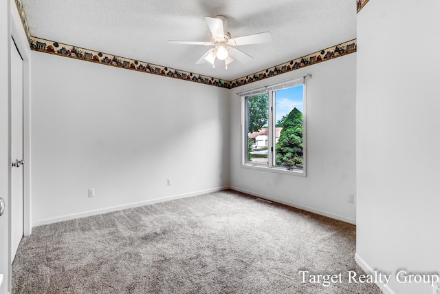 271 Rolling Greene Dr NW, Grand Rapids, MI 49534 - carpeted spare room featuring a textured ceiling and a ceiling fan