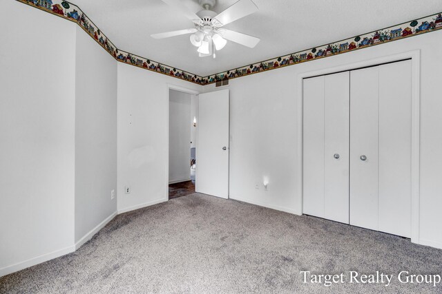 271 Rolling Greene Dr NW, Grand Rapids, MI 49534 - unfurnished bedroom featuring carpet, a closet, and a ceiling fan
