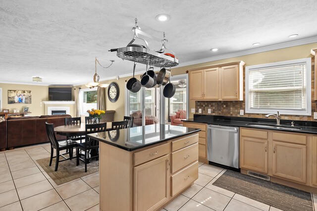 16069 Grazenview St, Schoolcraft, MI 49087 - kitchen featuring dishwasher, light brown cabinetry, crown molding, plenty of natural light, and a textured ceiling