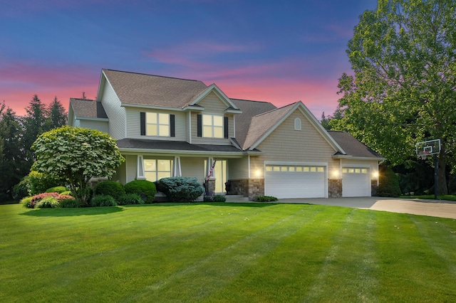 16069 Grazenview St, Schoolcraft, MI 49087 - view of front of property featuring concrete driveway, an attached garage, a yard, covered porch, and stone siding