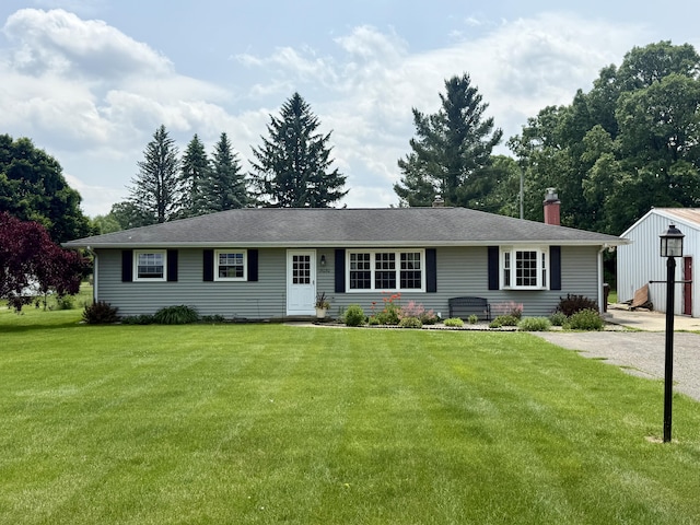 15030 N A Dr N, Marshall, MI 49068 - ranch-style house with a chimney, a front yard, and an outbuilding
