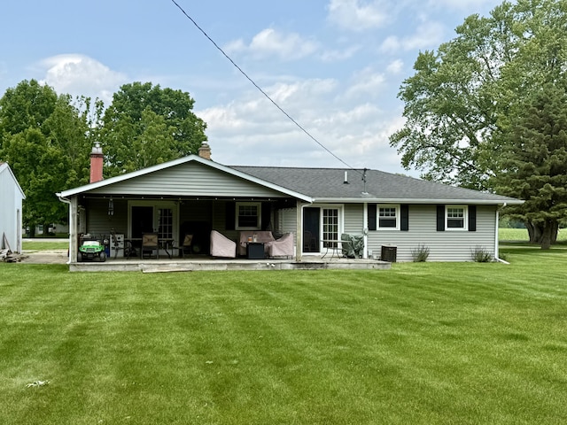 15030 N A Dr N, Marshall, MI 49068 - back of property with a yard, a patio area, a chimney, roof with shingles, and outdoor lounge area