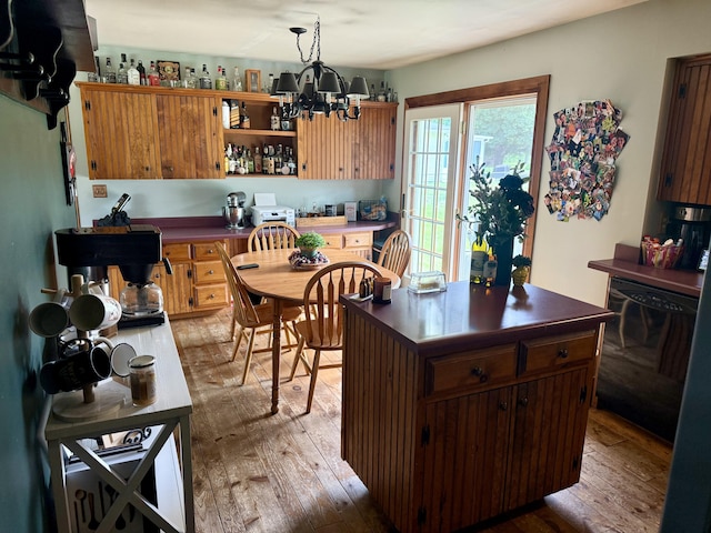 15030 N A Dr N, Marshall, MI 49068 - kitchen with light wood-type flooring, dark countertops, black dishwasher, and a chandelier