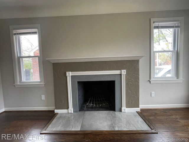 21128 Kenmore Ave, Harper Woods, MI 48225 - detailed view of wood finished floors and a fireplace with flush hearth