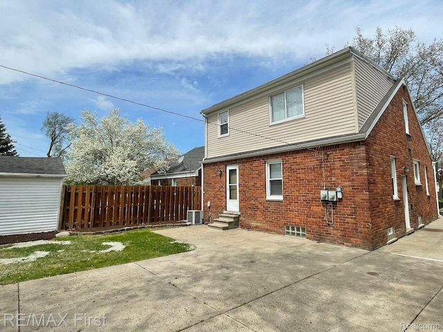 21128 Kenmore Ave, Harper Woods, MI 48225 - back of house featuring a patio, brick siding, and entry steps
