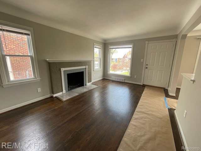 21128 Kenmore Ave, Harper Woods, MI 48225 - unfurnished living room with a premium fireplace and wood finished floors