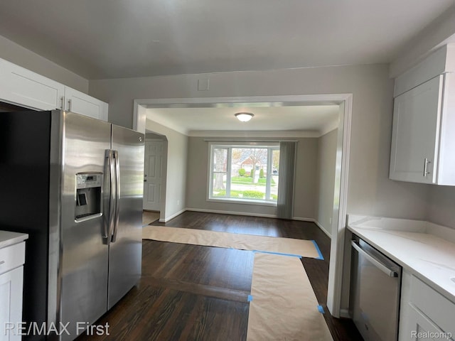 21128 Kenmore Ave, Harper Woods, MI 48225 - kitchen featuring appliances with stainless steel finishes, dark wood-style floors, and white cabinetry