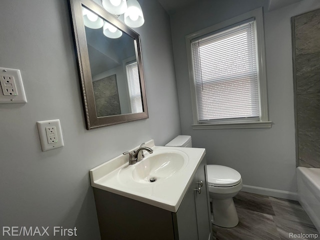 21128 Kenmore Ave, Harper Woods, MI 48225 - bathroom with vanity, a tub to relax in, wood finished floors, and a shower