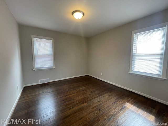 21128 Kenmore Ave, Harper Woods, MI 48225 - spare room with dark wood finished floors