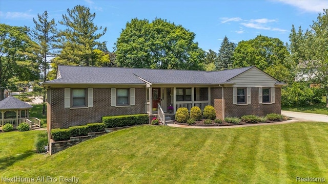 22219 Connemara Dr, Northville, MI 48167 - ranch-style home with brick siding, covered porch, a gazebo, and a front lawn