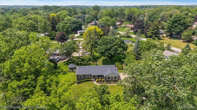 22219 Connemara Dr, Northville, MI 48167 - view of property location featuring a heavily wooded area