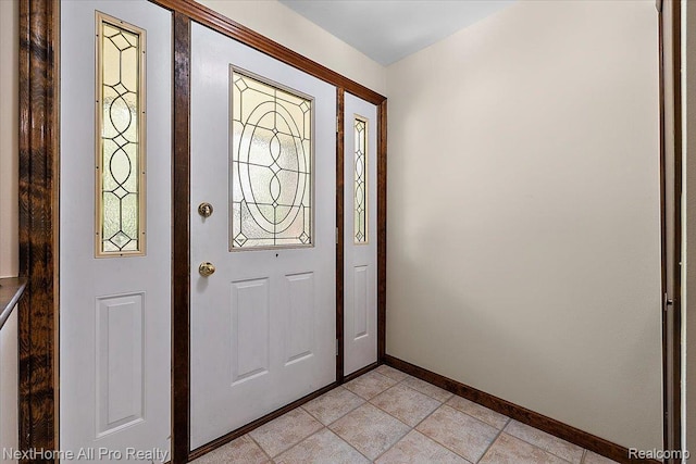 22219 Connemara Dr, Northville, MI 48167 - foyer with baseboards and light tile patterned floors