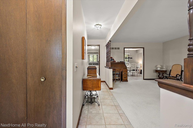 22219 Connemara Dr, Northville, MI 48167 - hallway featuring light carpet and light tile patterned floors