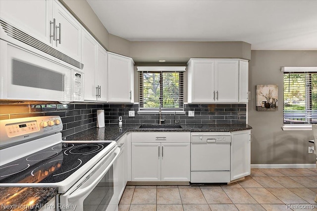 22219 Connemara Dr, Northville, MI 48167 - kitchen featuring white appliances, healthy amount of natural light, and white cabinetry