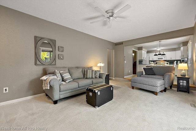 22219 Connemara Dr, Northville, MI 48167 - living room with light colored carpet and ceiling fan