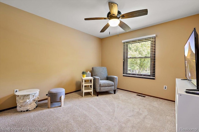 22219 Connemara Dr, Northville, MI 48167 - sitting room with light colored carpet and a ceiling fan