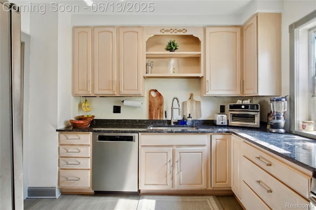 1390 W Blvd, Berkley, MI 48072 - kitchen featuring dishwasher, light brown cabinetry, decorative backsplash, and dark stone counters