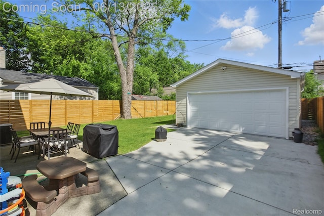 1390 W Blvd, Berkley, MI 48072 - fenced backyard featuring a grill, an outdoor structure, and a garage