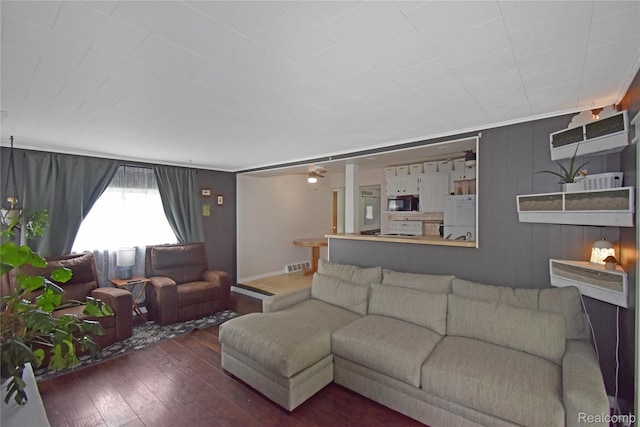 4466 Eastwood Dr, Swartz Creek, MI 48473 - living area featuring hardwood / wood-style floors and wood walls