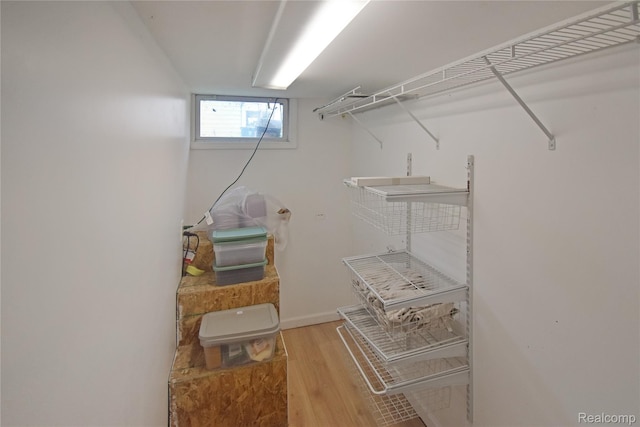 4466 Eastwood Dr, Swartz Creek, MI 48473 - walk in closet with wood finished floors