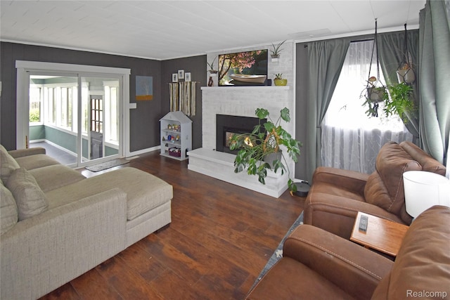 4466 Eastwood Dr, Swartz Creek, MI 48473 - living room with plenty of natural light, a fireplace, and wood finished floors