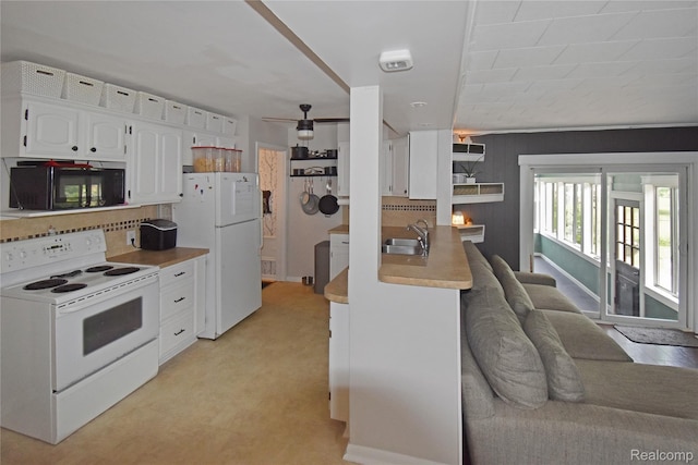 4466 Eastwood Dr, Swartz Creek, MI 48473 - kitchen featuring white appliances, white cabinets, tasteful backsplash, and light countertops