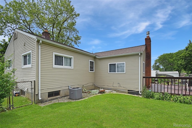 4466 Eastwood Dr, Swartz Creek, MI 48473 - rear view of house with a chimney