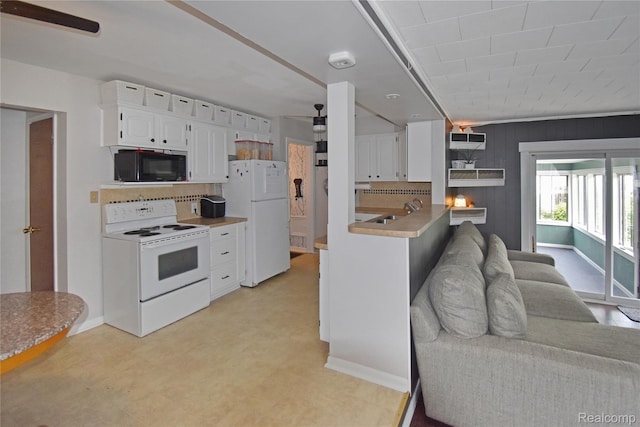 4466 Eastwood Dr, Swartz Creek, MI 48473 - kitchen with white appliances, white cabinetry, tasteful backsplash, light floors, and a peninsula