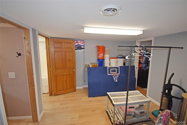 4466 Eastwood Dr, Swartz Creek, MI 48473 - recreation room featuring light wood-style flooring and baseboards