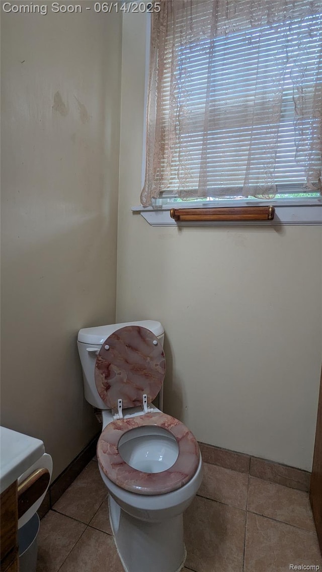 100 Oliver St, Pontiac, MI 48342 - half bathroom with tile patterned flooring and healthy amount of natural light