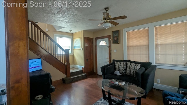 100 Oliver St, Pontiac, MI 48342 - living room with stairway, ceiling fan, wood finished floors, and a textured ceiling