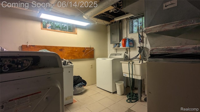 100 Oliver St, Pontiac, MI 48342 - laundry area featuring washer and clothes dryer, light tile patterned floors, and electric panel