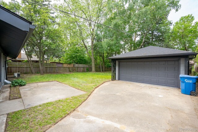 32431 Halmich Dr, Warren, MI 48092 - view of yard featuring a detached garage and an outdoor structure