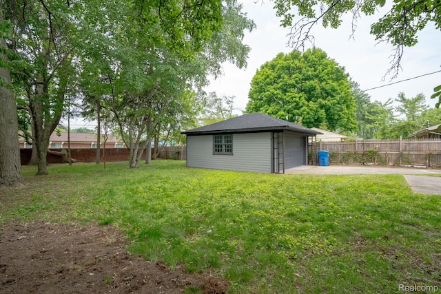 32431 Halmich Dr, Warren, MI 48092 - view of yard with a garage and an outdoor structure