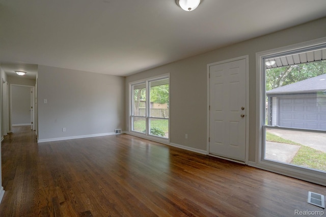 32431 Halmich Dr, Warren, MI 48092 - foyer entrance with dark wood-style floors and healthy amount of natural light