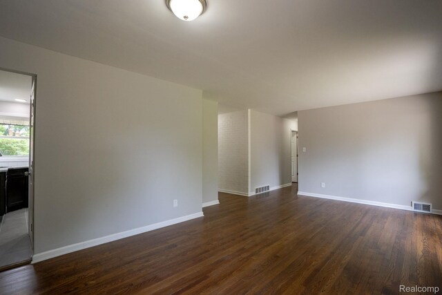 32431 Halmich Dr, Warren, MI 48092 - empty room with dark wood finished floors