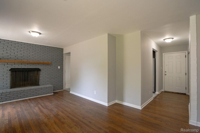 32431 Halmich Dr, Warren, MI 48092 - unfurnished living room with wood finished floors and a fireplace