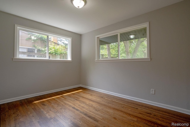 32431 Halmich Dr, Warren, MI 48092 - spare room with healthy amount of natural light and wood finished floors