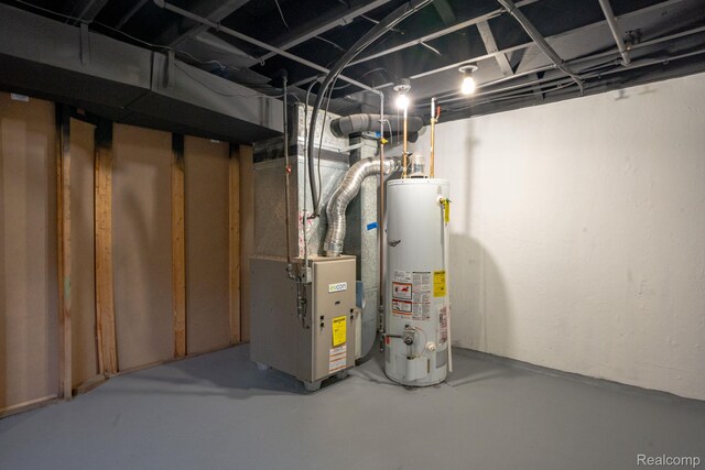 32431 Halmich Dr, Warren, MI 48092 - unfinished basement featuring water heater and heating unit