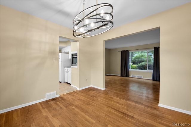 27416 Audrey Ave, Macomb, MI 48092 - unfurnished dining area featuring a chandelier and light wood-type flooring