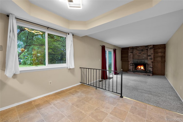 27416 Audrey Ave, Macomb, MI 48092 - unfurnished living room featuring built in features, a brick fireplace, and carpet