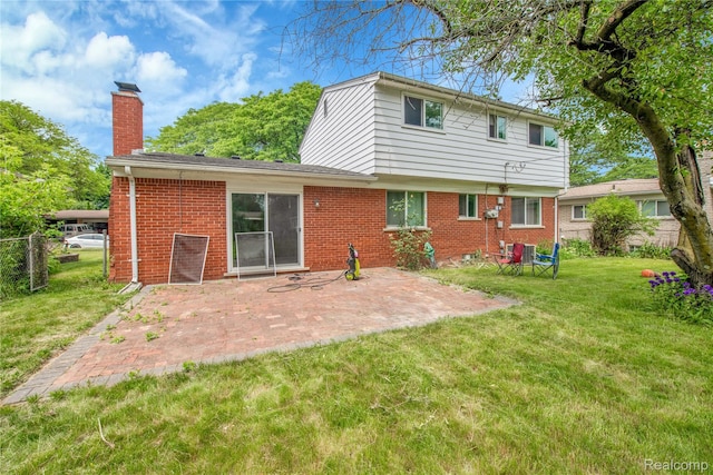 27416 Audrey Ave, Macomb, MI 48092 - back of property with a chimney, brick siding, and a patio area