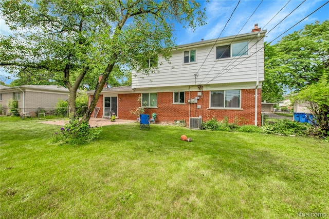 27416 Audrey Ave, Macomb, MI 48092 - back of property featuring a chimney, brick siding, and a patio area