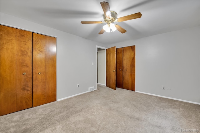 27416 Audrey Ave, Macomb, MI 48092 - unfurnished bedroom with two closets, carpet floors, and ceiling fan